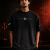 Front view of a male model wearing the BhaariGear Lord Hanuman black ombré boxy fit t-shirt featuring minimalist chest typography.