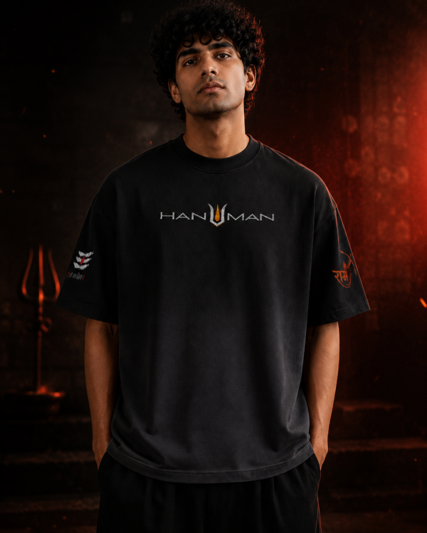 Front view of a male model wearing the BhaariGear Lord Hanuman black ombré boxy fit t-shirt featuring minimalist chest typography.