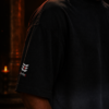 Close up of the left sleeve on the black ombré t-shirt showing the Shiva tripundra and Om Namah Shivaya Hindi text.leftsleeve