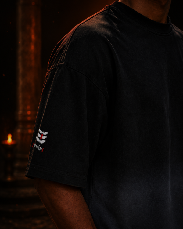 Close up of the left sleeve on the black ombré t-shirt showing the Shiva tripundra and Om Namah Shivaya Hindi text.leftsleeve