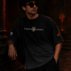 Male model leaning against a temple pillar wearing the BhaariGear Lord Hanuman black ombré t-shirt.